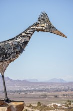 Giant Recycled Roadrunner statue made entirely from discarded materials by artist Olin Calk at an