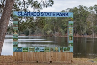 Permanent painte wooden photo prop beside Lake Ivy at Clarko State Park near Quitman, Mississippi,