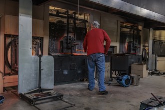Glass blower demonstrates the art of blowing glass at the Dollywood amusement park in Pigeon Forge,