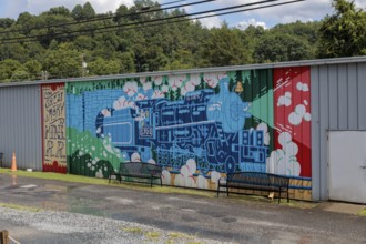 Mural on the back of a building welcomes Great Smoky Mountains Railroad passengers back to Bryson