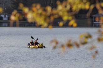 Senior couple paddleing a an inflatable kayak on Archusa Creek Lake at Archusa Creek Water Park