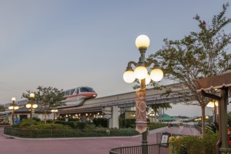 Monorail carries passengers toward the entrance to the Magic Kingdom at Walt Disney World in