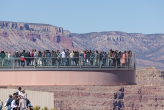 Visitors view the Grand Canyon from the Skybridge, a glass floored bridge extending 70 feet over