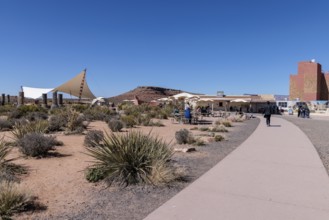 Umbrella shaded tables and a large awning provide visitors shade from the desert sun at Eagle Point