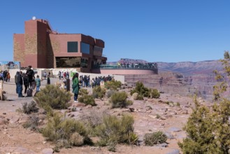 Guests view the canyon from the ground and from the Skybridge, a glass floored bridge overlooking
