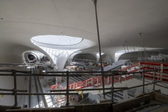 Underground cathedral, view of a modern interior under construction with glass roof, construction