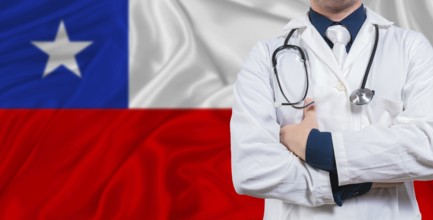 Male doctor with stethoscope on Chile flag. Doctor holding stethoscope on Chile flag