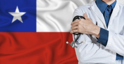 Doctor with stethoscope on Chile flag. Doctor holding stethoscope on Chile flag