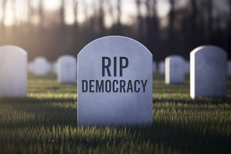 Tombstone in graveyard with text RIP Democracy. Visual metaphor for the decline of democratic