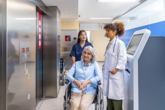 Medical professionals providing care and support to a senior woman in a wheelchair, navigating a