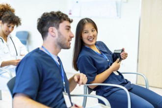 Group of medical professionals attending a conference, actively engaging in discussion and learning