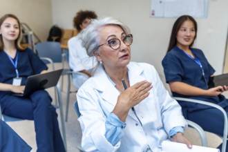 Experienced doctor leading a medical conference, actively engaging with her colleagues by