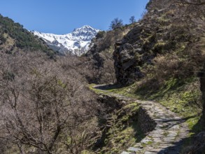Hiking trail Vereda de la Estrella, snow-covered mountain range in early spring, Sierra Nevada,
