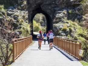 People on the Tranvía de Sierra Nevada, former railroad track, leading to the trail Vereda de la