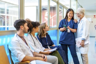 Doctors and nurses reviewing medical records on a smartphone, fostering collaboration and