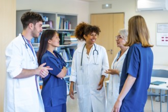 Diverse medical professionals collaborating, sharing expertise, and strategizing for optimal