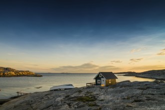 Fisherman's cottage by the sea at sunset, Smögen, Bohuslän, Sweden