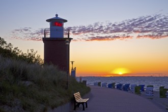 Olhörn lighthouse at colourful sunrise over the sea on the North Frisian island of Föhr,