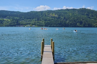 Lake shore, wooden jetty, rowing boats, summer, Lake Millstatt, Millstatt, Carinthia, Austria