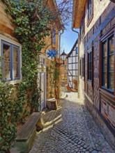 Narrow, romantic passageway with half-timbered houses on the Schlossberg, Old Town of the World