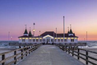 Restaurant on Ahlbeck Pier/ Seebrücke Ahlbeck in the Baltic Sea at sunrise on Usedom island,