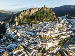 The White Town of Zahara de la Sierra below a Moorish castle. Aerial view. Drone shot. Cádiz