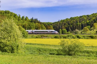 InterCityExpress ICE travelling across the Swabian Alb. Idyllic landscape in spring. Lonsee,