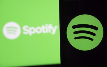 Spotify logo is seen on a smartphone