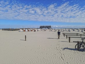 Preparing for the high season on the beach, setting up the beach chairs, North Sea, on the edge of