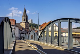 Modern bridge with a view of the church and half-timbered houses, blue sky, The town of Rotenburg