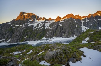 Rocky mountain peaks and Trollfjordvatnet with snow, at the Trollfjord Hytta, mountain landscape