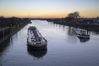 Ships on the Rhine-Herne Canal, Duisburg lock, at sunset, Duisburg, Ruhr area, North