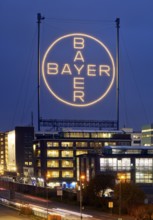Bayer cross in the blue hour on the premises of Bayer AG, Leverkusen, Bergisches Land, North