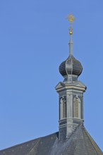 Spire of the baroque castle church built in 1773 with golden weather vane, turret, ridge turret,
