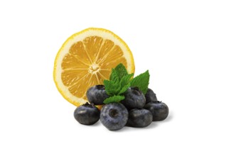 Lemon with blueberries and mint, on a white background, isolate, food concept