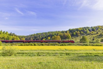 ÖBB RailJet travelling across the Swabian Alb. Idyllic landscape near Lonsee in spring. Lonsee,