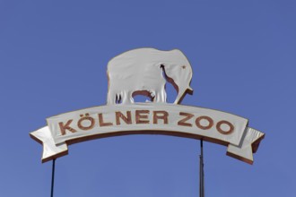 Cologne Zoo 165 years, anniversary sign covered with fabric in front of a blue sky, Cologne, North
