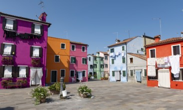 Colourful houses with washing lines and flowers, colourful house facades, alleyways on the island