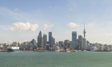 Skyline with modern skyscrapers and harbour against a blue sky Auckland, New Zealand, Oceania