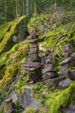 Moss-covered stone towers in a forest that radiate balance and tranquillity, Glaswaldsee, Bad