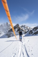 Ski tourer with rope, rope team on the Vadret da Porchabella glacier on the ascent to the summit of