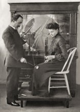 A patient being treated by Proffessor Wilhelm Conrad Röntgen with a friction spark treatment, an