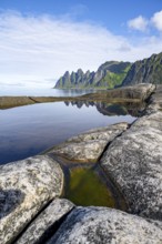 Reflection in a tidal pool, rocky coast of Tungeneset, Devil's Teeth, Okshornan, Ersfjorden, Senja