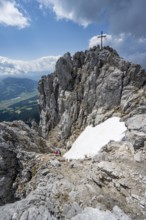 Mountain peak Ackerlspitze with summit cross, mountaineer on the last ascent to the summit, Wilder