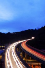 Federal road B14 in the evening, road bridge with traffic and light traces. Long exposure.