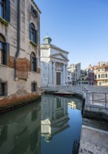 Church Chiesa di Santa Maria Maddalena, reflected in the canal, Cannaregio, Venice, Veneto, Italy