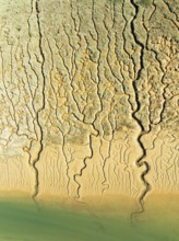 Network of channels and streams at low tide. In the marshland adjacent to the Odiel river. Aerial