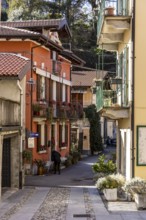 Alley with colourful houses, Mergozzo, Lago di Mergozzo, Piedmont, Italy