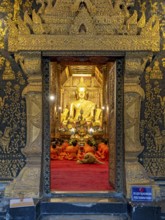 Buddha image at Wat Xieng Thong Sim ordination hall, Luang Prabang, Laos