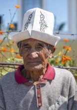 Portrait, local elderly man with traditional hat, Issyk-Kul region, Kyrgyzstan